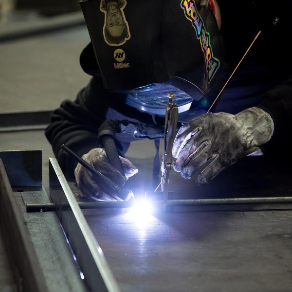 https://www.coremarkmetals.com/files/image/medium/welder stick welding steel round bar and angles
