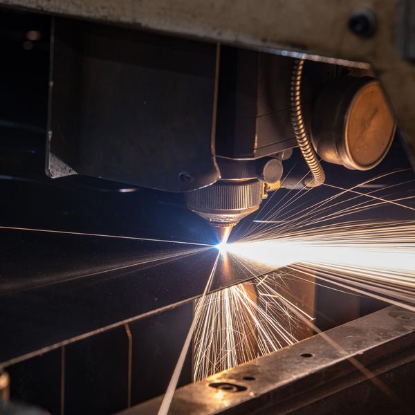 https://www.coremarkmetals.com/files/image/medium/co2 laser cutting metal sheets sparking