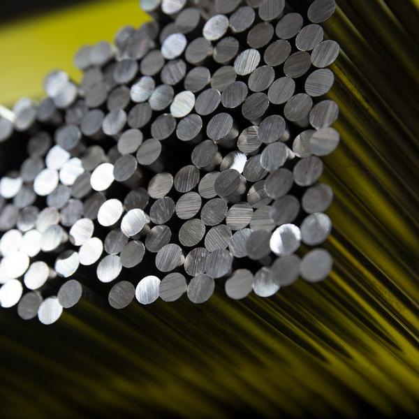 https://www.coremarkmetals.com/files/image/medium/metal round bar stock stacked in racking