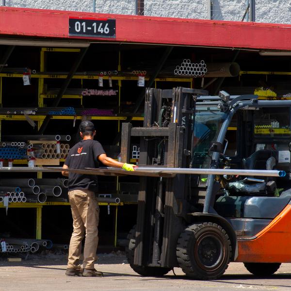 https://www.coremarkmetals.com/files/image/medium/forklift operator in metal yard pulling material