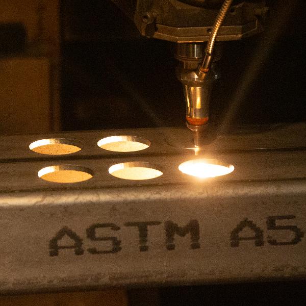 https://www.coremarkmetals.com/files/image/medium/circles cut out of steel using tube laser