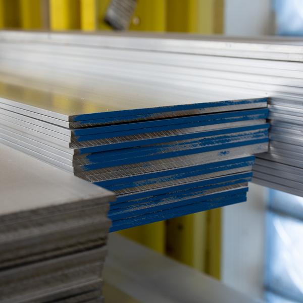 https://www.coremarkmetals.com/files/image/medium/Wide flat aluminum bar stock stacked together